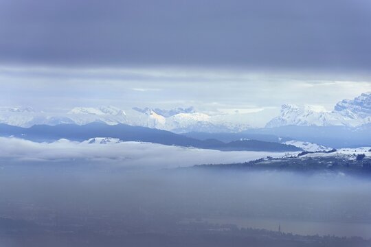 Fog over Lake Zug in the foreground the village of Cham, behind the snow-covered Alps, Beinwil, Freiamt, Horben, Lindenberg, Canton of Aargau, Switzerland