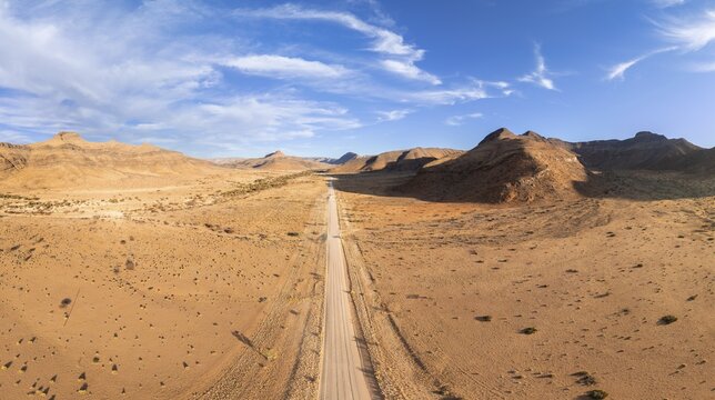 Aerial view, Eternally long straight road, road C14 through the Naukluft Mountains, desert and dry mountains, Namibia