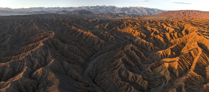 Evening atmosphere, Mountain peaks of the Tien Shan Mountains, Dramatic barren landscape of eroded hills, Badlands, Canyon of the Forgotten Rivers, Issyk Kul, Kyrgyzstan