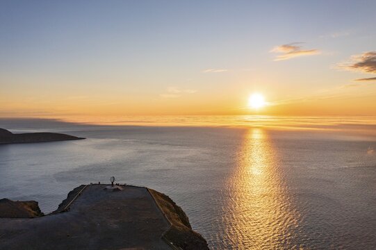 Steel globe at the North Cape under the midnight sun, Nordkapp, Finnmark, Norway