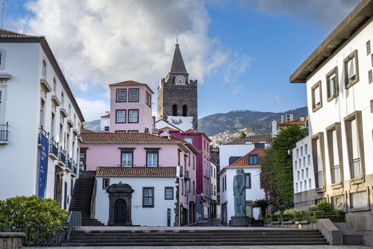 Small square in the old town with colourful houses and chapel Capela de Santo Antonio de Mouraria, tower of the church S&eacute; do Funchal in the back, Funchal, Madeira, Portugal