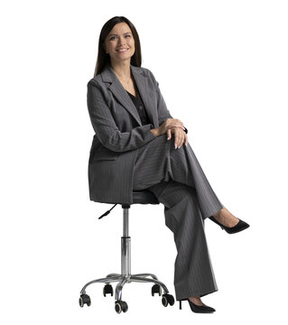 Portrait of a cheerful young businesswoman sitting in a chair against transparent background. Full body