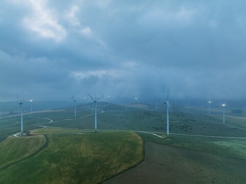 Windmills on a wind farm near Zahara de los Atunes, at a cloudy dawn, aerial view, drone shot, C&aacute;diz province, Andalusia, Spain