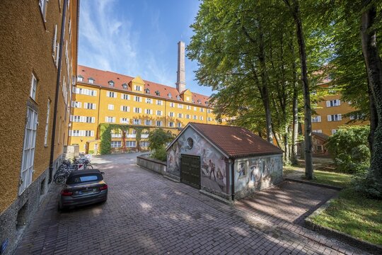Inner courtyard with yellow apartment buildings, Borstei, heritage-protected housing estate, Moosach district, Munich, Bavaria, Germany