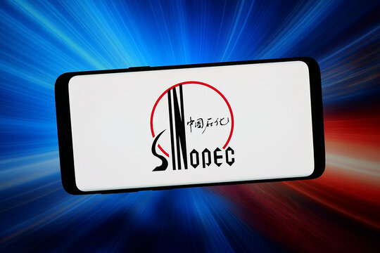 Stuttgart, Germany - 02-20-2026: In this photo illustration, the logo of Chinese petroleum company Sinopec Group is displayed on a smartphone in front of abstract background on computer screen.