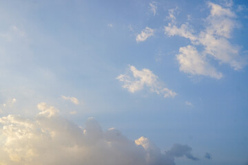 The night sky is filled with fluffy cirrus or cumulus clouds, indicating clear weather. Birds can...