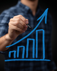 a man hand drawing a blue graph with an upward-pointing arrow