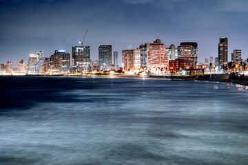 Fototapeta premium Tel Aviv skyline coast at night, modern Middle Eastern city, Israel.