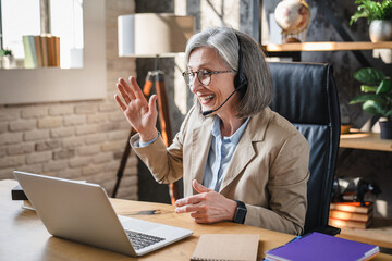 Smile, headset or attorney on technology webinar and hello or greeting hands in legal office. Woman, wave or video call conference, lawyer training workshop virtual consulting appointment. © InsideCreativeHouse