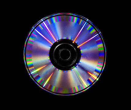 Abstract concept, colorful CD DVD iridescent laser disc on a black isolated background