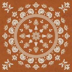 Intricate floral pattern with symmetrical design on a brown background