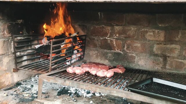 Meat and Chorizo Cooking on Parrilla &ndash; Authentic Argentina BBQ Experience, Asado
