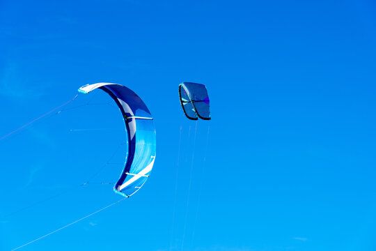 Two blue kitesurfing kites against the sky, Tarifa, Spain, Andalusia.