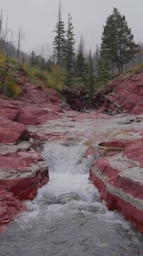 Red Rock Canyon waterfall flowing through argillite in Waterton Lakes National Park