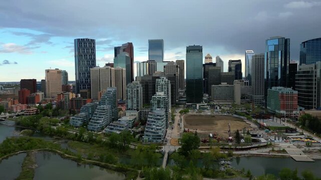 Calgary skyline panoramic view showing modern skyscrapers and residential buildings along Bow River