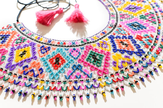 Traditional Ukrainian beaded necklace Sylyanka with colorful folk patterns on white background.