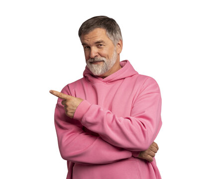 Happy middle aged man in pink sweatshirt, smiling older professional manager looking at camera, presenting ads advertising product or service isolated on transparent background