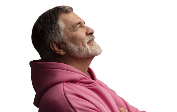 Caucasian smiling bearded mature man wearing pink hoodie on transparent background. Standing indoors
