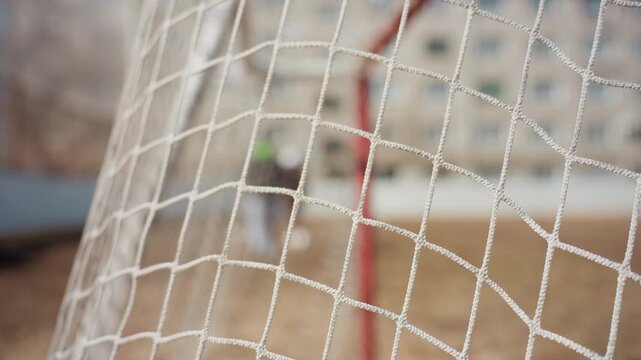 football nets celebration, closeup of ball and net, exciting moment capturing ball contact and stadium atmosphere, intense scene of soccer ball striking net during vibrant game celebration