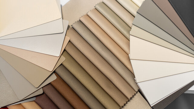 catalogs, samples, selection of fabric and color of curtains, color of walls, textiles and furniture. beige shades. exhibition samples, advertising, interior design, home comfort, color palette
