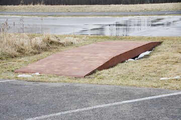 walking bridge low between parking lots