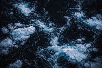 Obraz premium Churning Ocean Water with Melting Ice Floes and Swirling Patterns