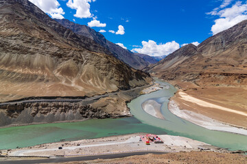Scenic beauty of the confluence of the Indus and Zanskar Rivers, known as Sangam, is located near Nimmu village, from Leh along the Leh-Srinagar Highway, NH1. Leh, Ladakh, India.