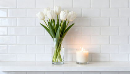 Elegant white tulips in a clear vase alongside a flickering scented candle, creating a serene and bright atmosphere against a pristine subway tile backdrop, perfect for home decor concepts