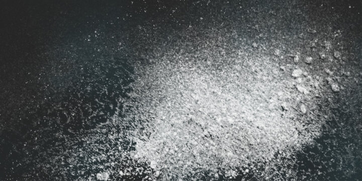 Flour spilling on black background. Abstract design of white powder cloud. Abstract wallpaper design of white color shiny snow dust powder isolated on black background .


