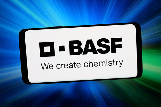 Stuttgart, Germany - 02-20-2026: In this photo illustration, the logo of German chemicals company BASF SE is displayed on a smartphone in front of abstract background on computer screen.