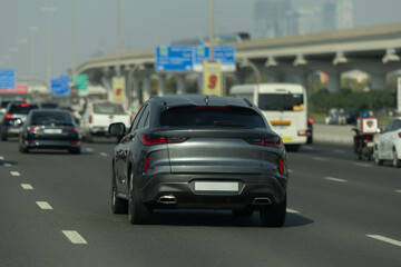 Fototapeta premium views of the highway on a sunny day in summer. Buildings and roads and cars.