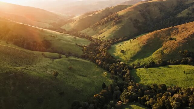 Scenic Aerial Landscape of Lush Green Valleys and Rolling Hills