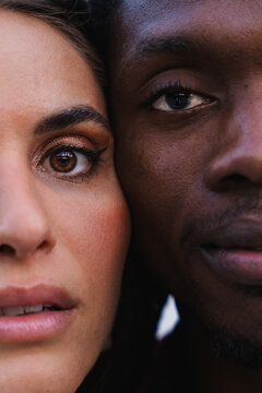 Multiracial couple's faces closely together, symbolizing love, diversity, and connection
