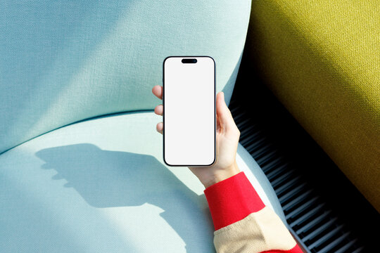 Phone Mockup with White Screen on Blue Chair
