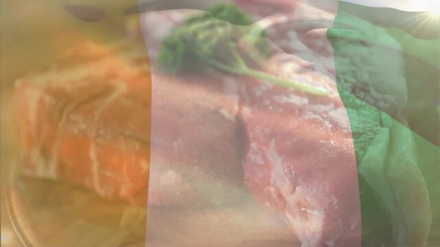Flag fading in, meat cuts shifting, parsley centering, lens flare lighting green stripe for montage