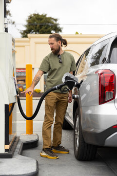 Man pumping petroleum at station 