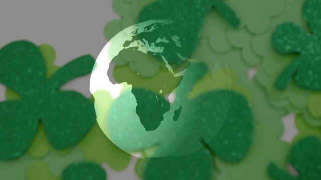 Stylized globe rotating and fading after soft green reveal, revealing glitter shamrock background