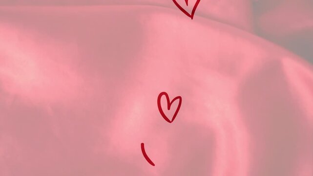 Single red heart appearing, red hearts sketching upward and settling on pink satin, showing love