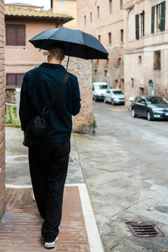 Walking in the Rain Through Old Streets