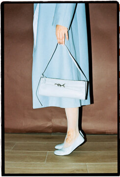 Minimal fashion with blue coat and matching bag