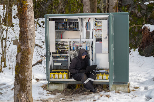 Technician Working outdoors on Communication Equipment 