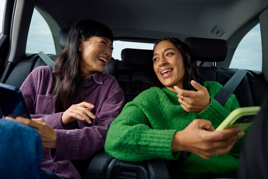 Women are traveling by car