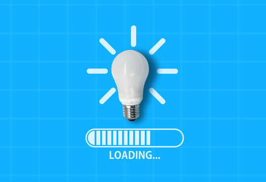 Light bulb on blue background with computer loading bar below and text &lsquo;Loading&hellip;&rsquo; &ndash; symbolizing ideas in progress, creativity under development, and innovation about to launch