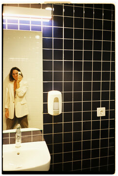Mirror Selfie in Tiled Bathroom