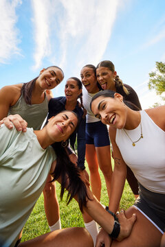 Cheerful group of friends posing for fun outdoors