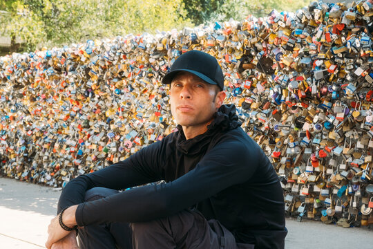 Man Sitting at San Antonio Love Lock Bridge