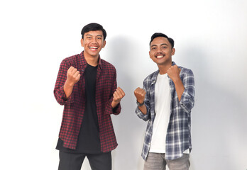 Obraz premium Asian men wearing shirts with joyful expressions are celebrating on an isolated white background.