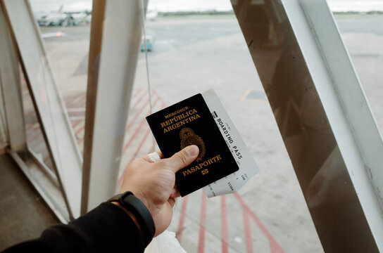 Travel Preparations at the Airport With a Passport in Hand