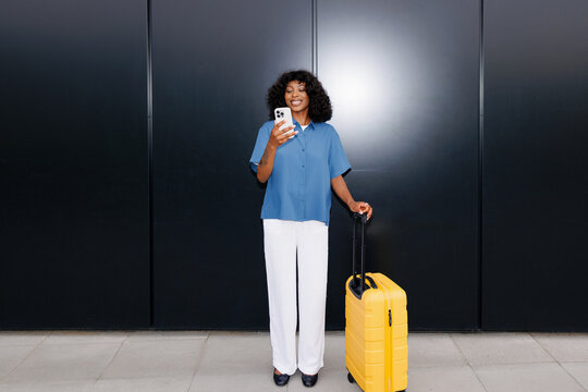 Business Traveler Woman Checking Phone Before Departure