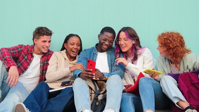 A lively group of friends sharing joyful experiences as they engage with amusing content on a smartphone, showcasing their camaraderie and connection through laughter and smiles.